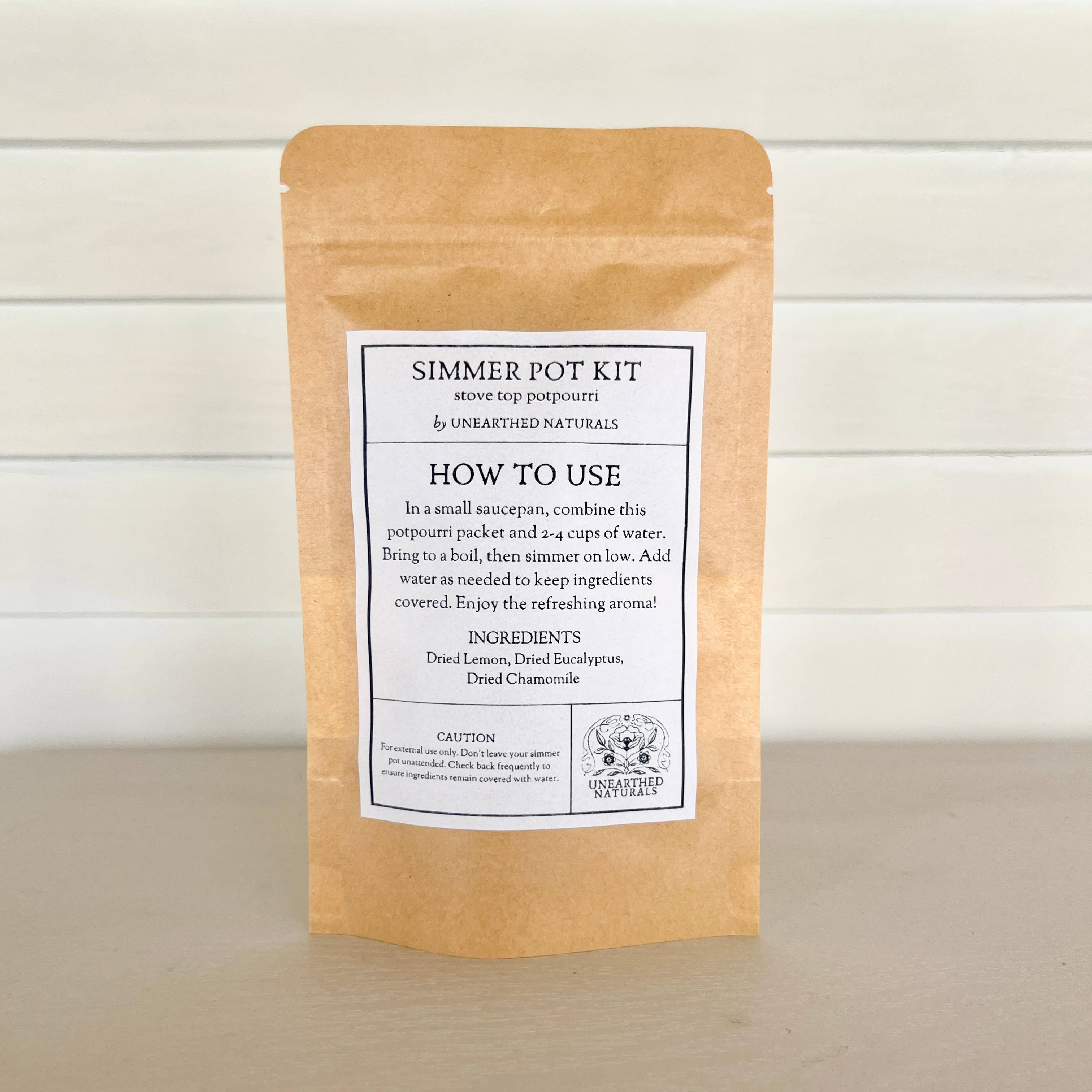 Kraft paper package with a label on a wooden surface and light wood panel background