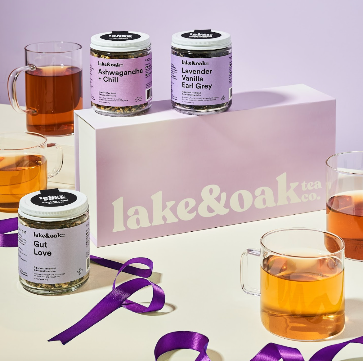 Lake & Oak tea packaging with jars and mugs on a light background