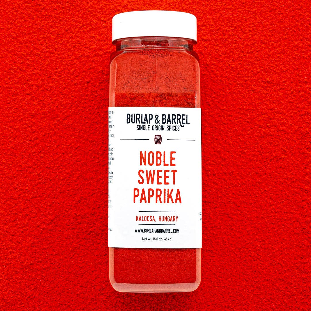 Container of Noble Sweet Paprika from Burlap & Barrel on a red background