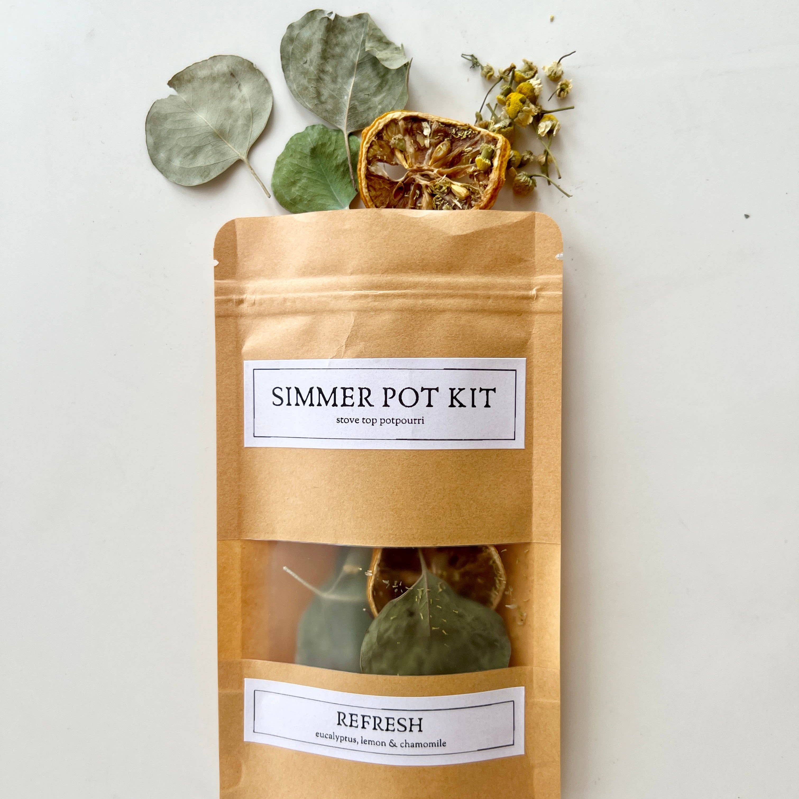 Simmer pot kit with dried herbs on a white background