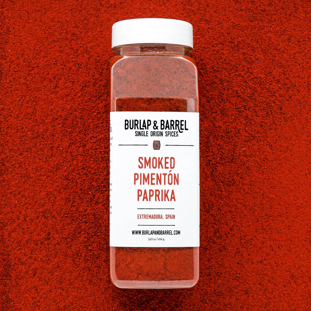 Container of Burlap & Barrel Smoked Pimentón Paprika on a red background