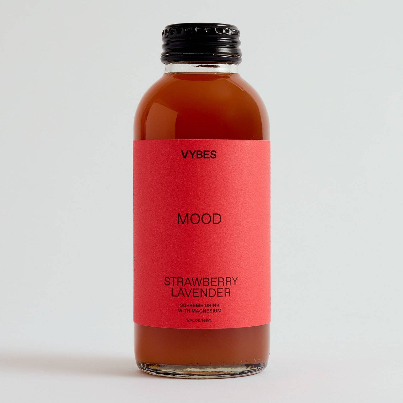 Bottle of VYBES Strawberry Lavender on a light gray background
