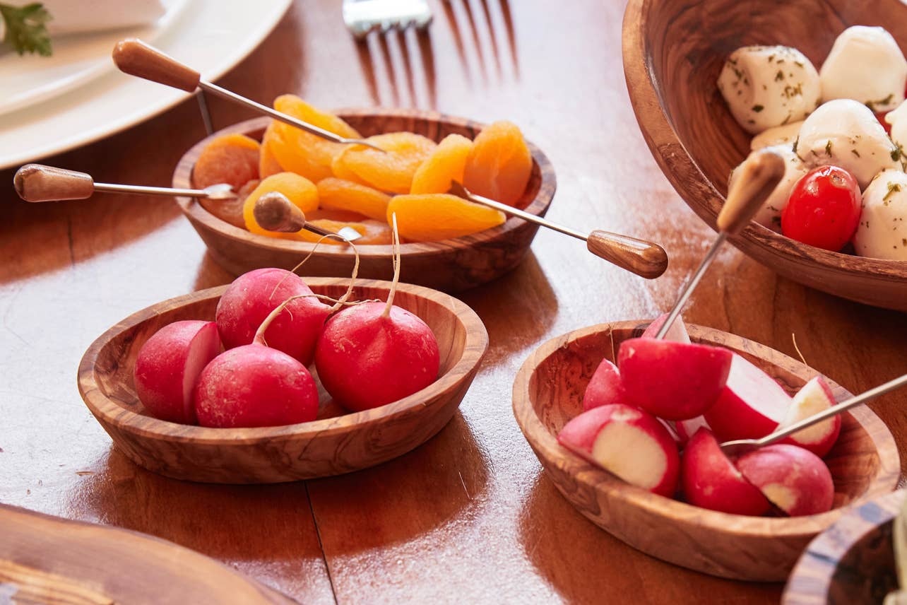 Italian Olivewood Aperitivo Bowls filled with radishes and dried fruit on skewers
