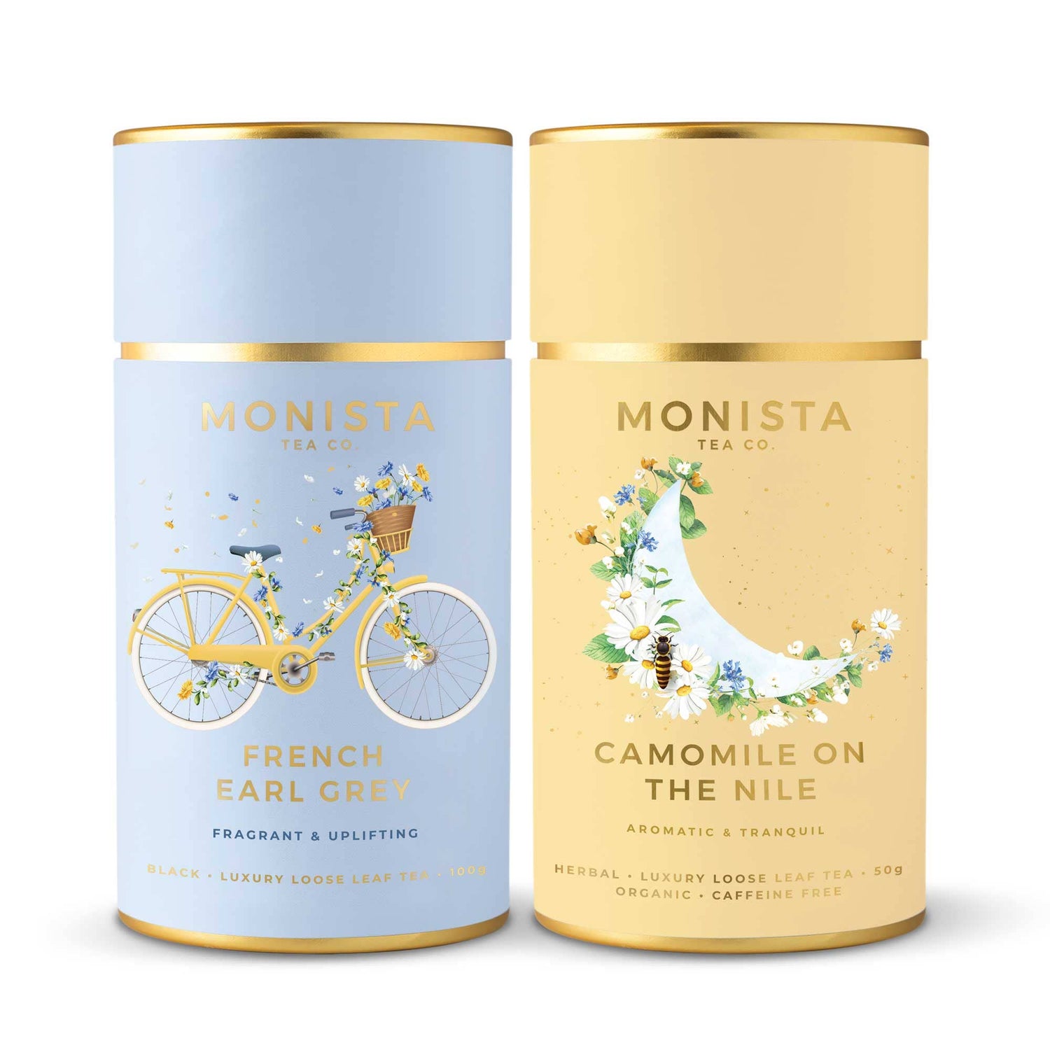 Two Monista Tea Co. tea canisters, one blue with a bicycle illustration and one beige with a sailboat illustration, on a white background.