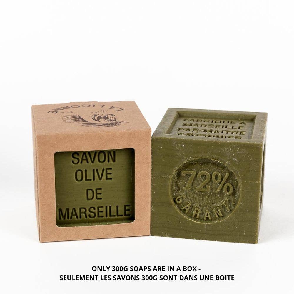 Green Marseille soap bar with a cardboard box on a white background