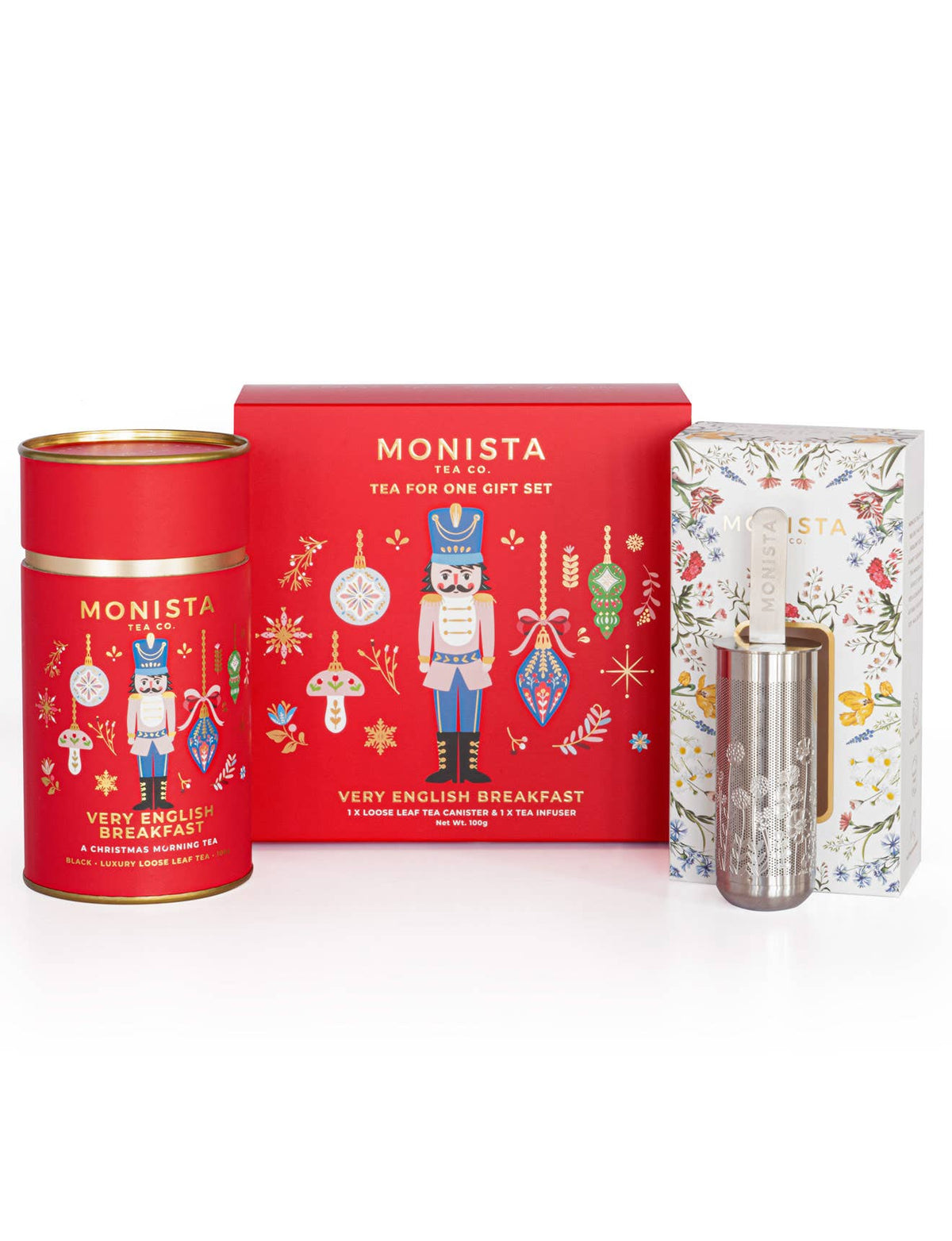 Monista Very English Breakfast Christmas black tea set with red canister, silver tea infuser stick, and decorative box on a white background