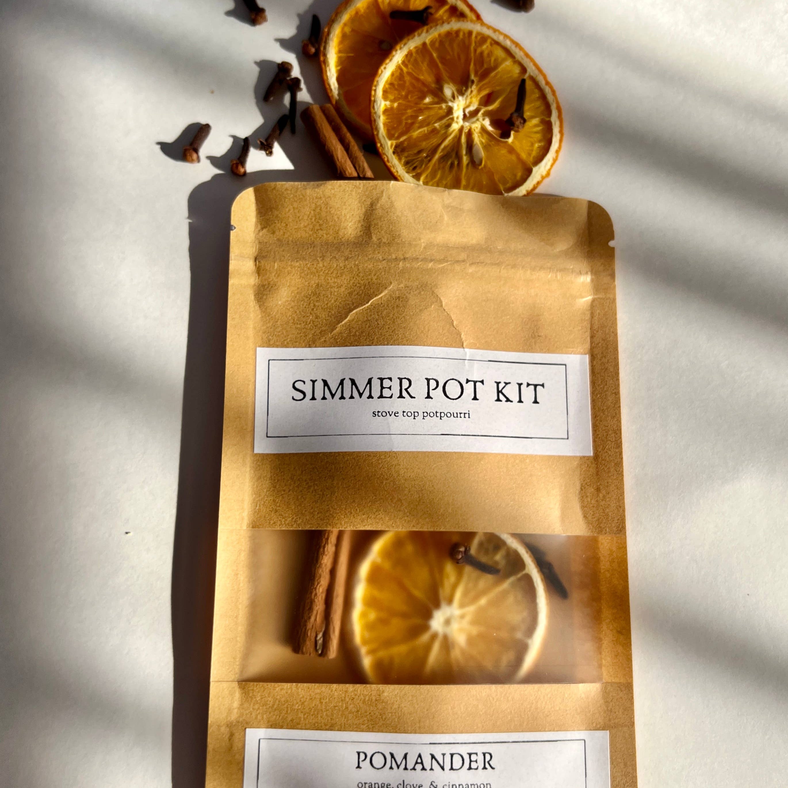 Simmer pot kit with pomander ingredients on a light background