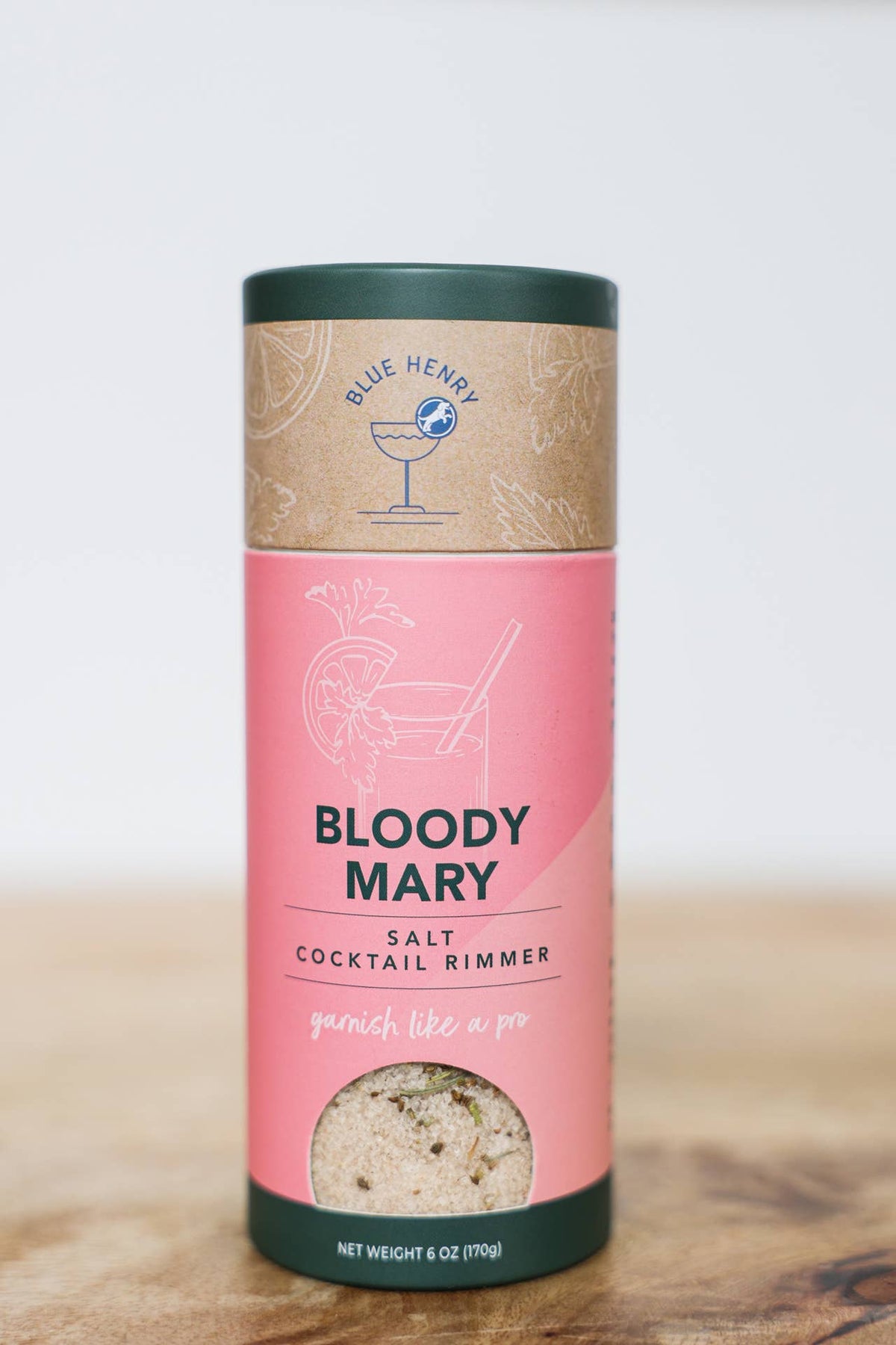 Pink cylindrical container of Bloody Mary salt cocktail rimmer with &