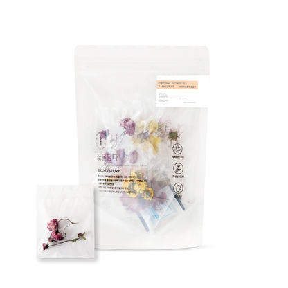 Floral tea packaging with dried flowers on a white background