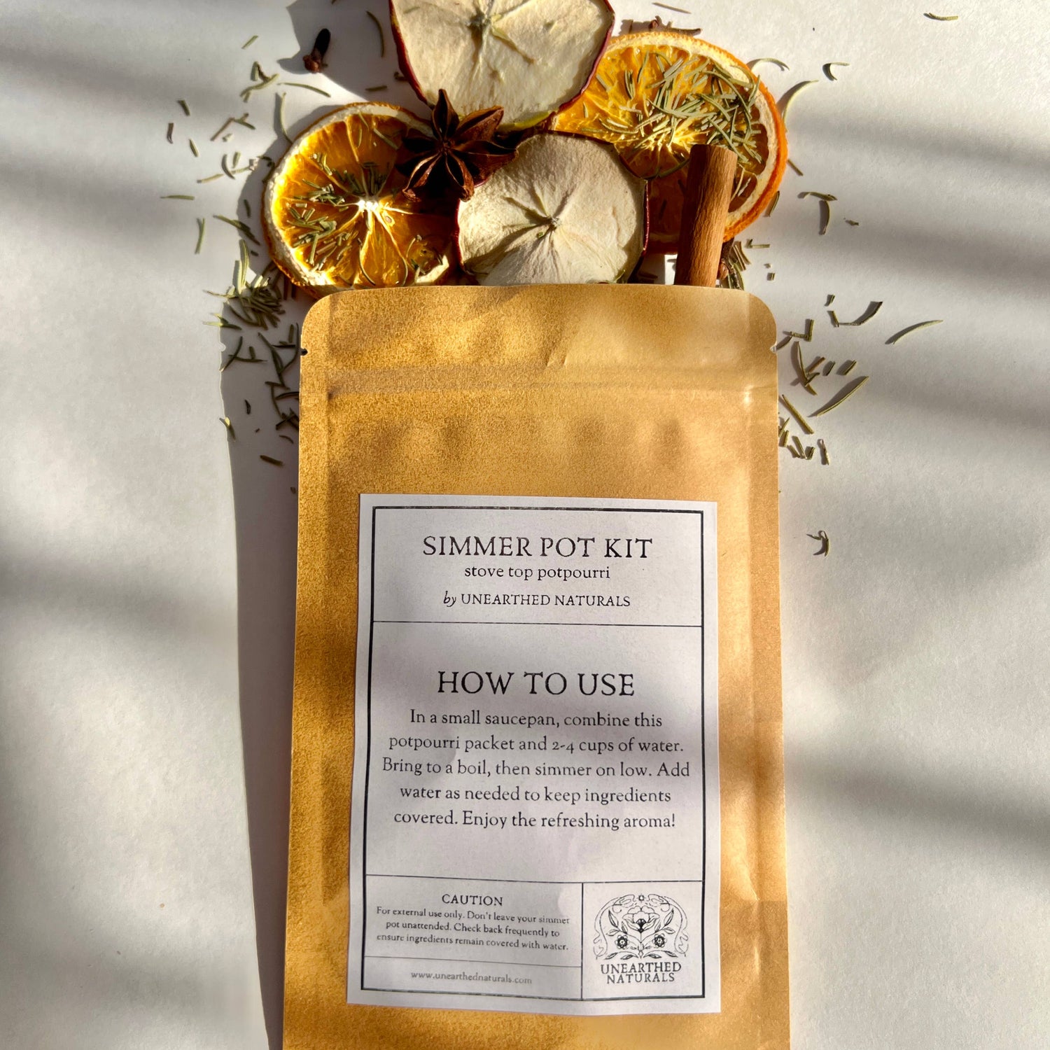 Simmer pot kit with dried fruits and spices on a light background