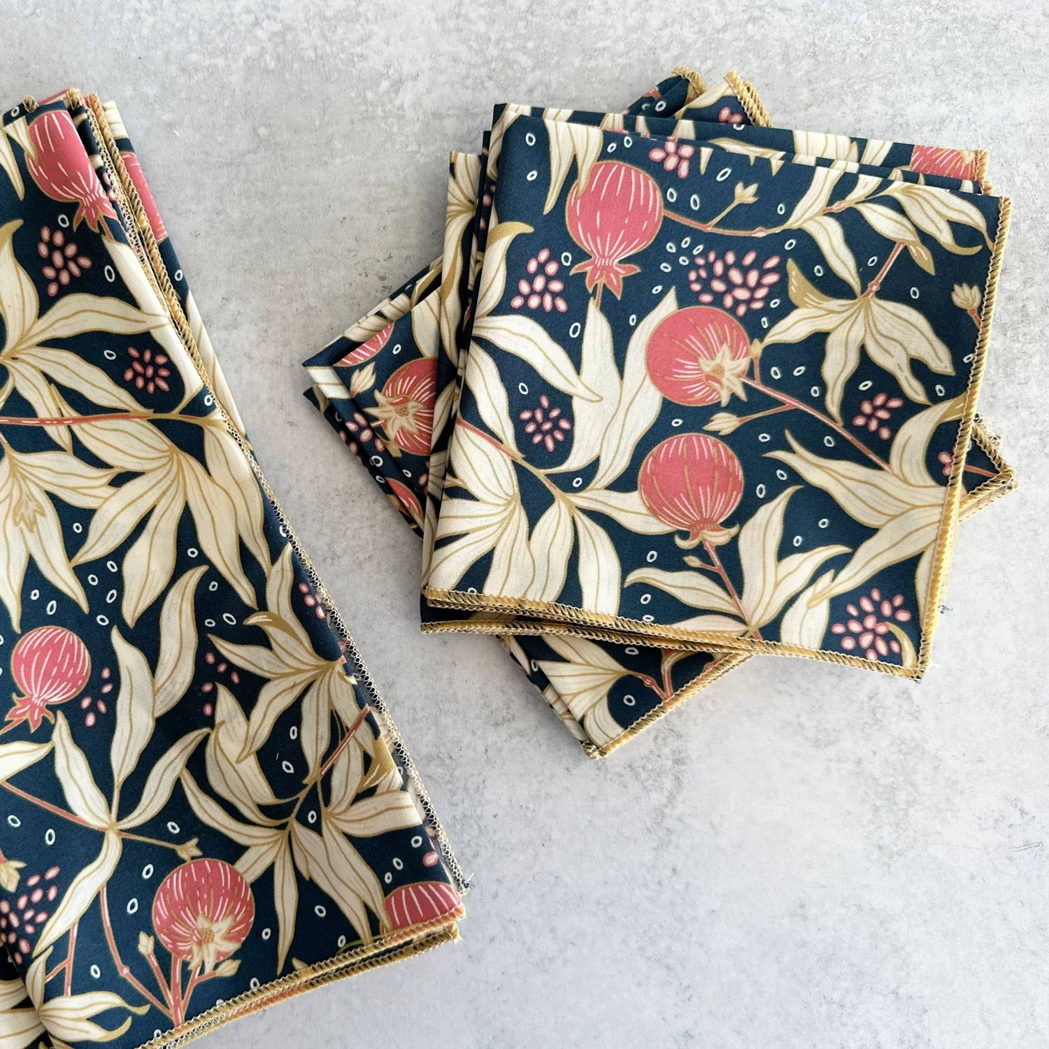 Set of floral-patterned napkins on a light gray surface