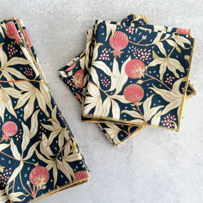 Set of floral-patterned napkins on a light gray surface