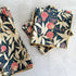 Set of floral-patterned napkins on a light gray surface