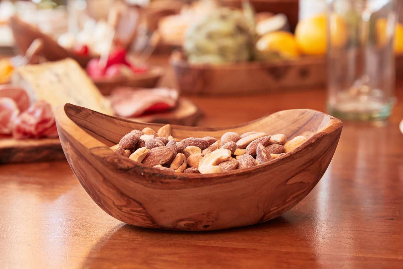 Italian Olivewood Serving Bowl filled with almonds and cashews