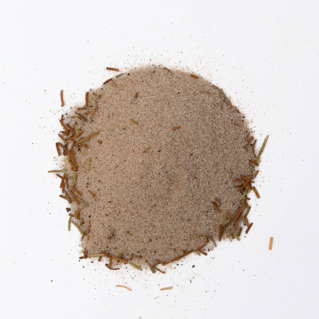 A mound of bloody mary cocktail rimming salt on a white background
