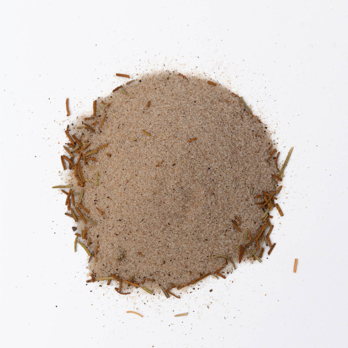 A mound of bloody mary cocktail rimming salt on a white background