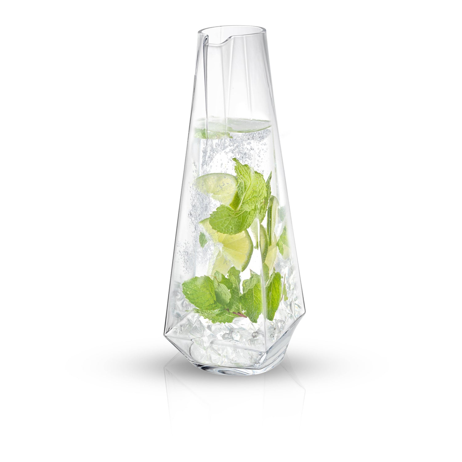 Clear glass vase with water and green leaves on a white background