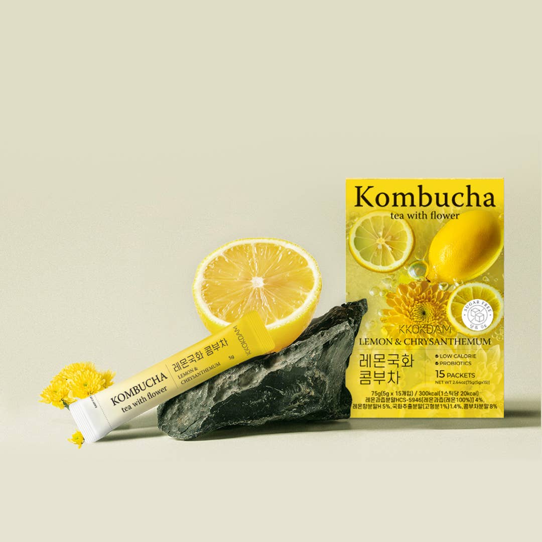 Kombucha tea packaging with lemon and chrysanthemum on a beige background