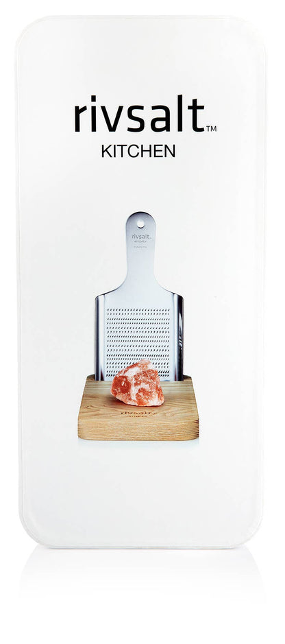 A salt grater with a salt rock and a stand from rivsalt kitchen
