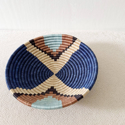 Woven basket with multicolor pattern on a light background