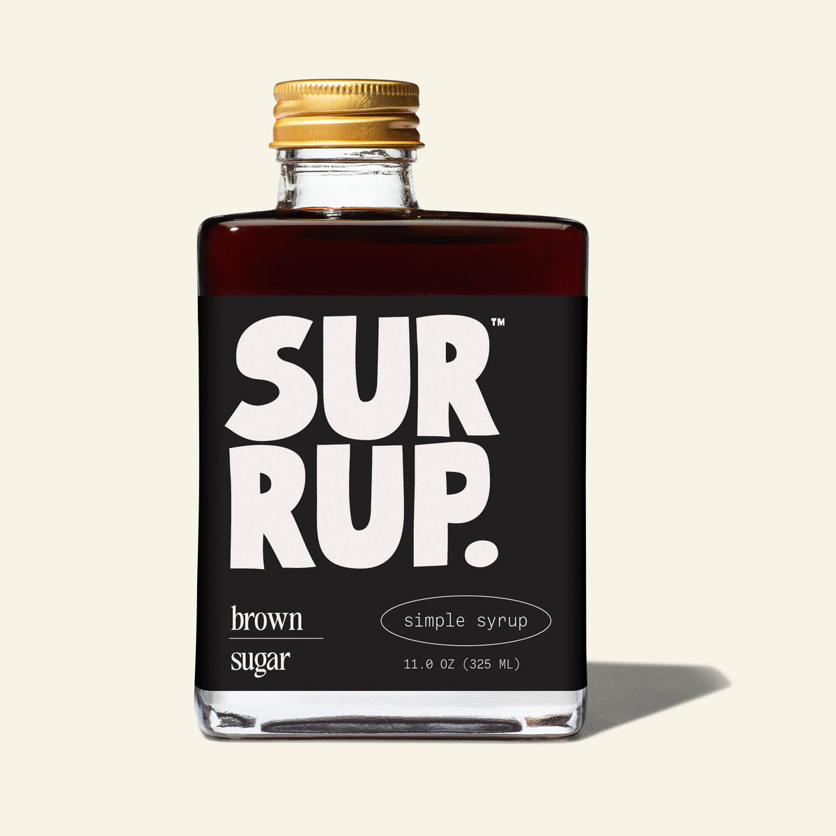 Bottle of SurRup brown sugar simple syrup with a black label on a white background