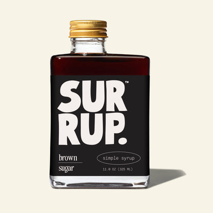 Bottle of SurRup brown sugar simple syrup with a black label on a white background