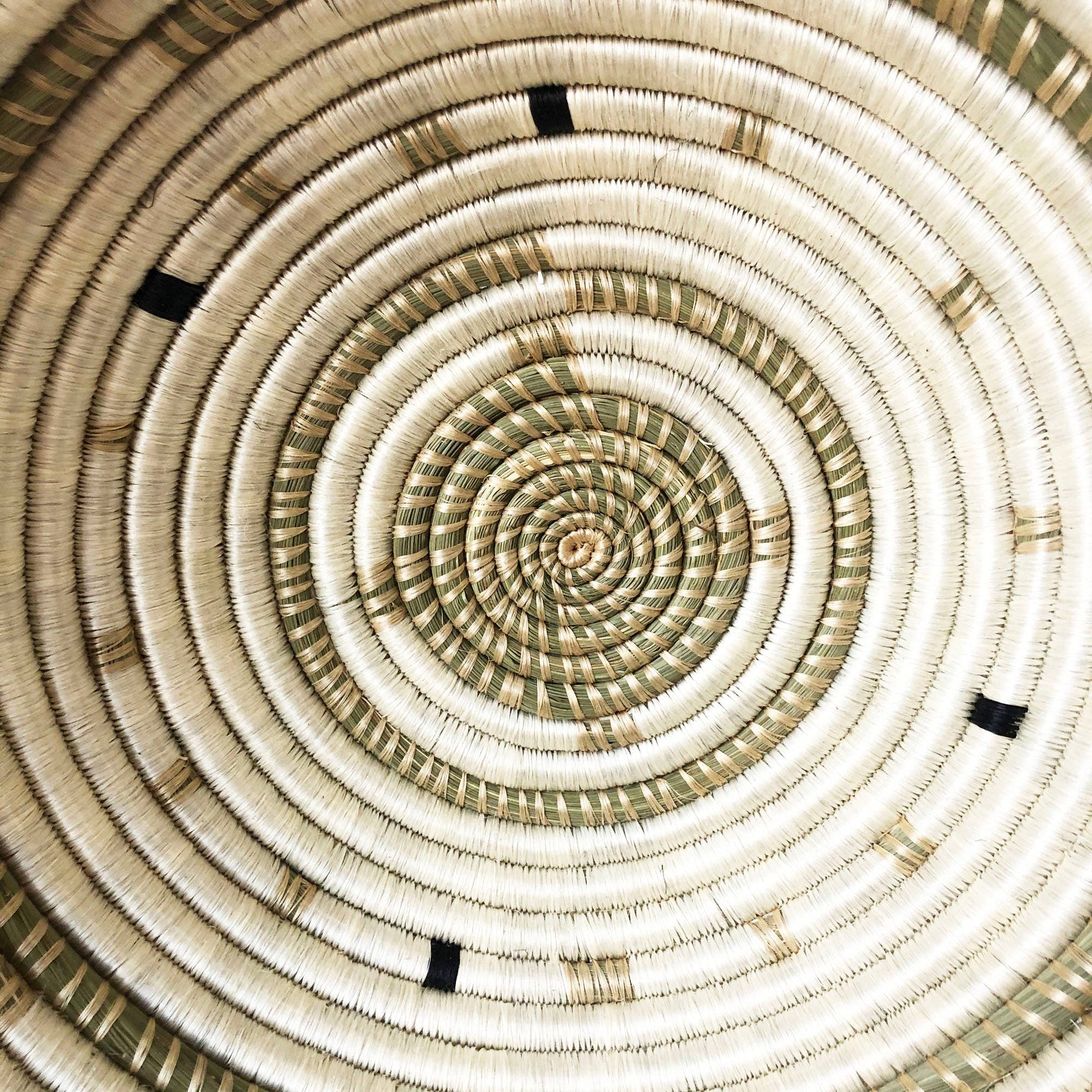 Close-up of a woven basket with concentric circular pattern