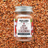 Jar of Burlap & Barrel Umami Steak Seasoning on a background of spice mix