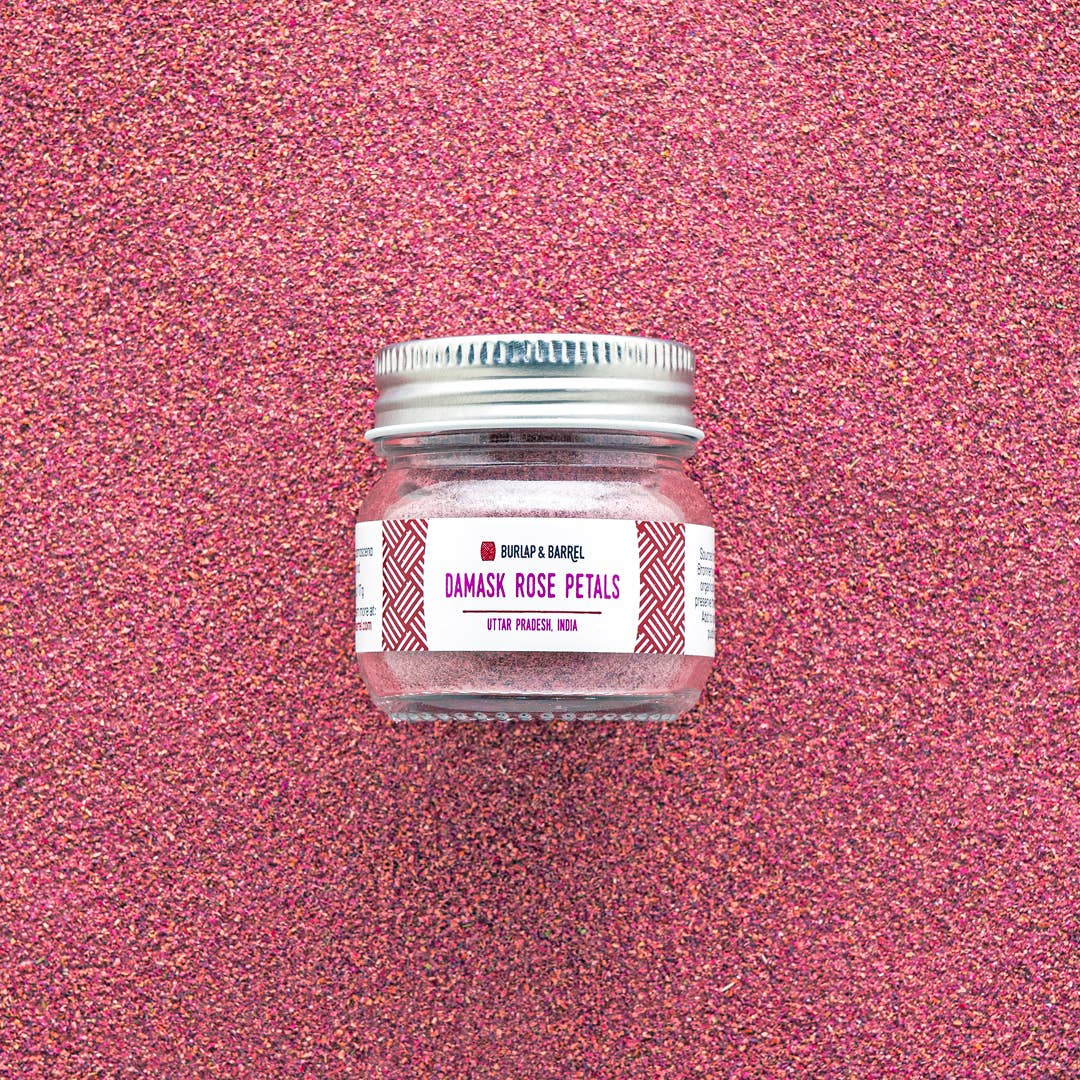 Jar of Damask Rose Petals with a label on a pink glittery background