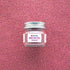 Jar of Damask Rose Petals with a label on a pink glittery background