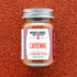 Jar of cayenne pepper with &
