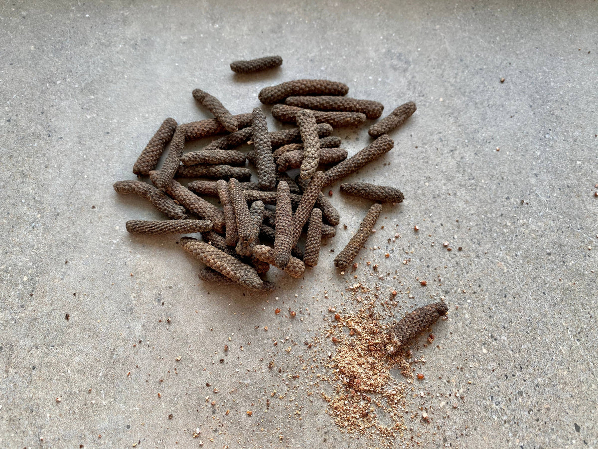 A pile of Java peppers, with once that&