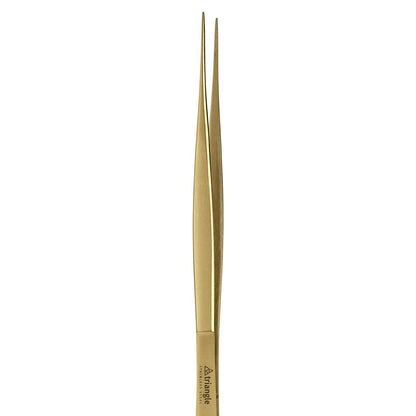 Gold-colored tweezers on a white background