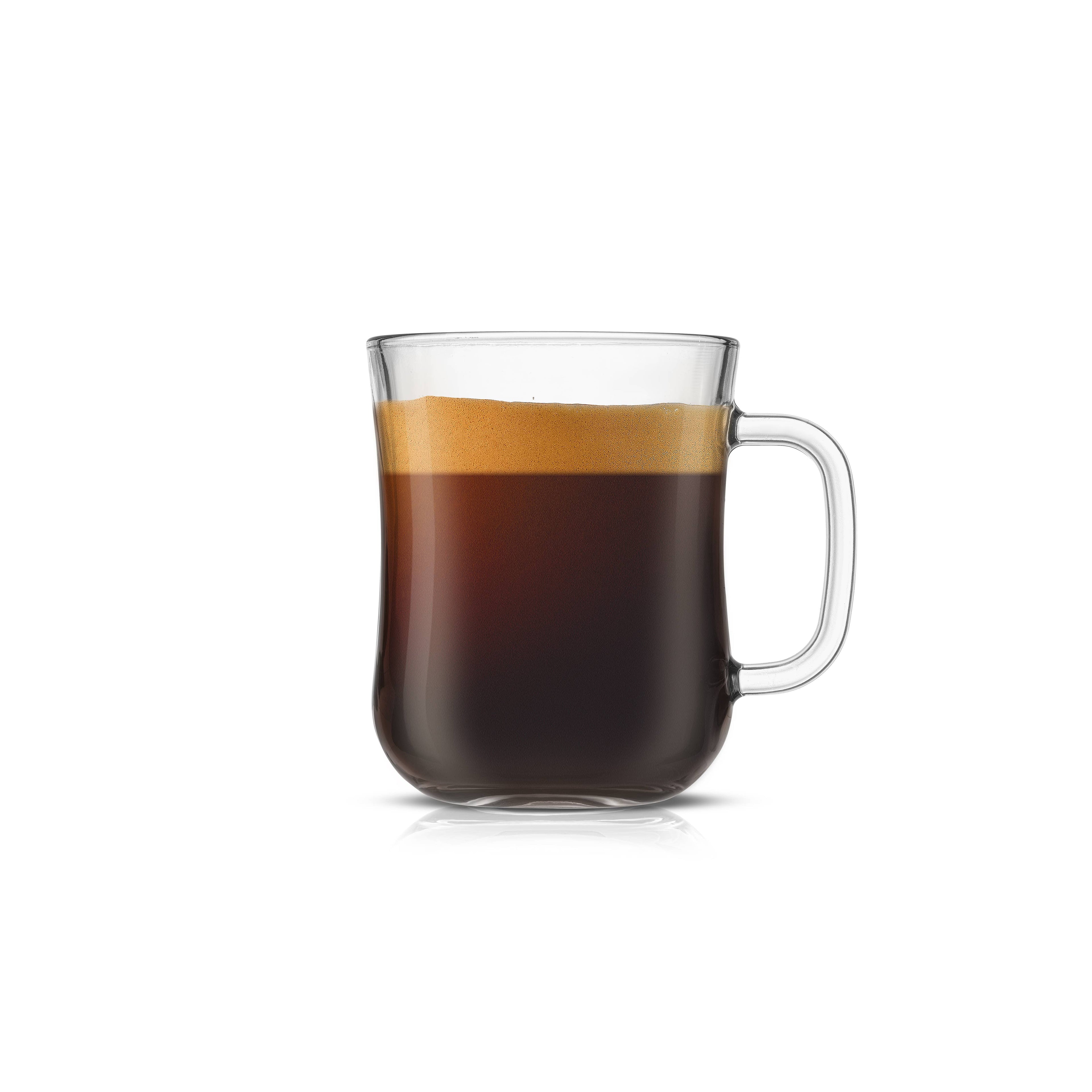 Clear glass mug filled with a layered drink on a white background