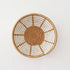 Woven basket with concentric circle pattern on a white background