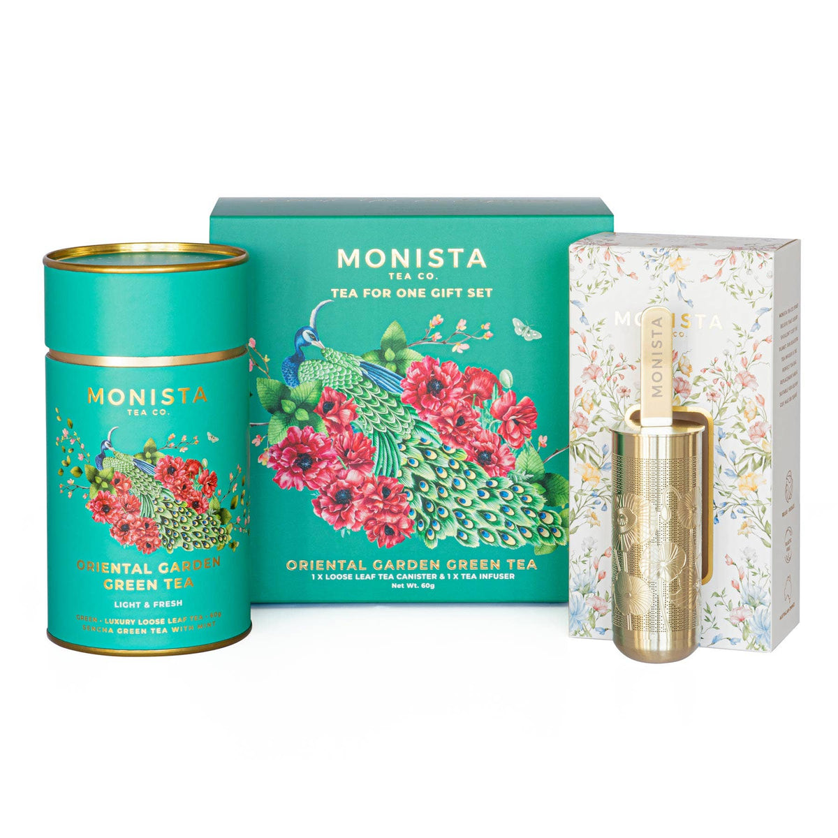 Monista Tea Co. Oriental Garden Green Tea gift set featuring a tea canister and a gold metal tea infuser stick, with a decorative box behind them.