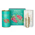 Monista Tea Co. Oriental Garden Green Tea gift set featuring a tea canister and a gold metal tea infuser stick, with a decorative box behind them.