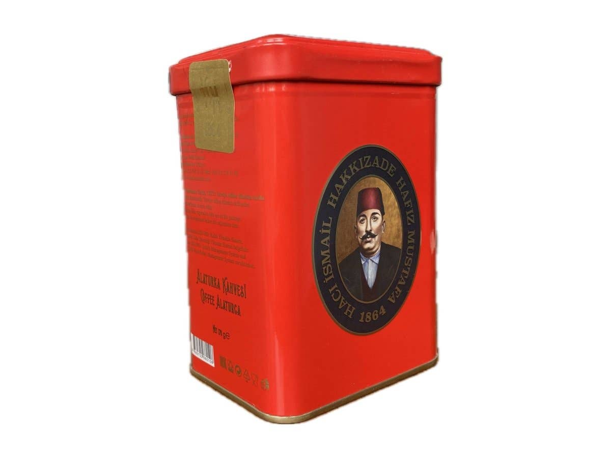 Red tin container with a portrait on a white background