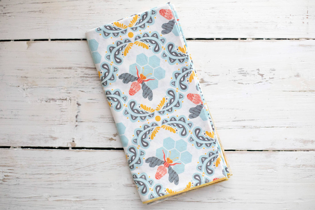 Honey bee napkins on a wooden surface