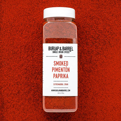 Container of Burlap &amp; Barrel Smoked Pimentón Paprika on a red background