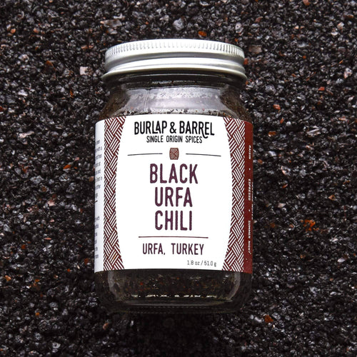 Jar of Black Urfa Chili from Burlap & Barrel on a dark surface