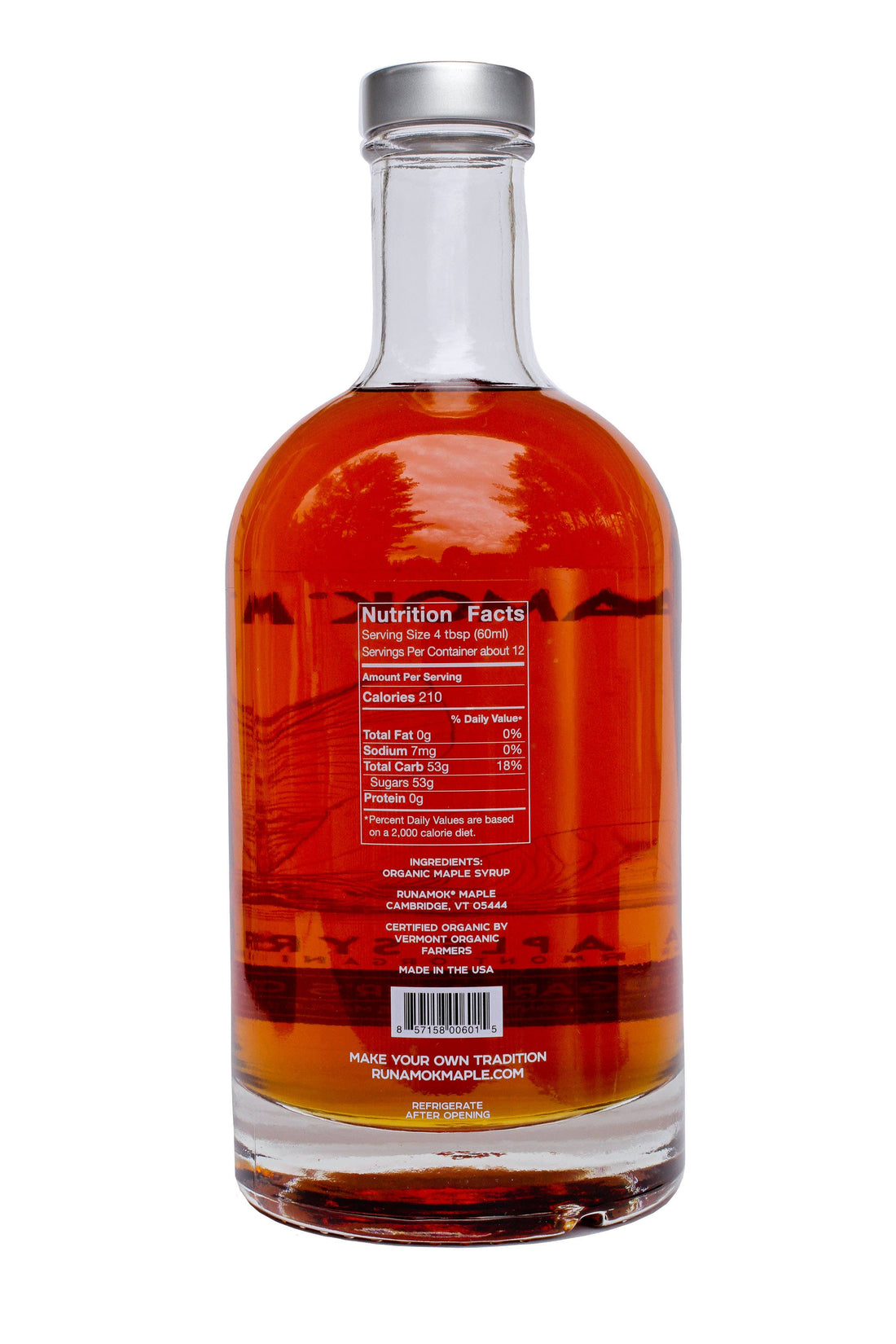 Bottle of amber liquid with a nutrition facts label on a white background