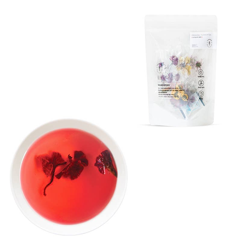 Red jelly-like sphere with floral elements and a white packaging labeled &