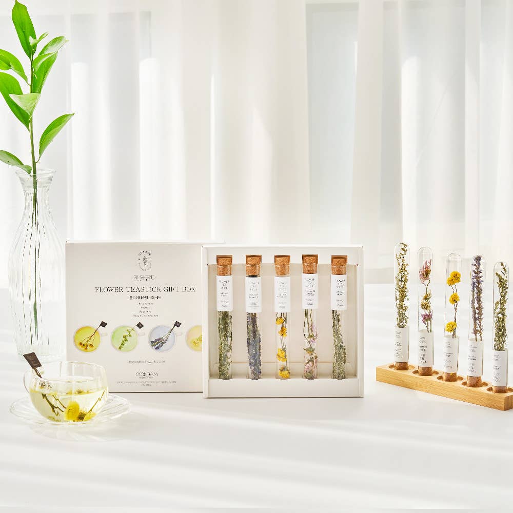 Flower tuition gift box with test tubes on a white surface