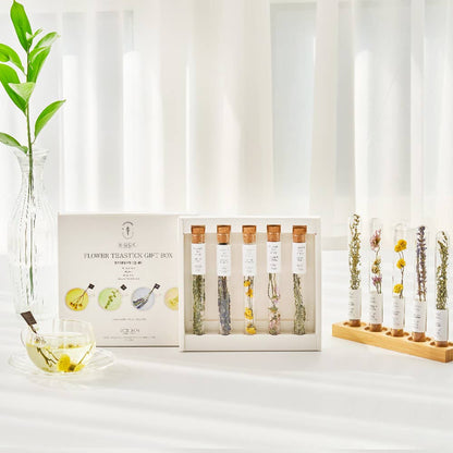 Flower tuition gift box with test tubes on a white surface