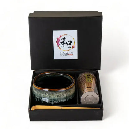 Ceramic tea set with a black box labeled &