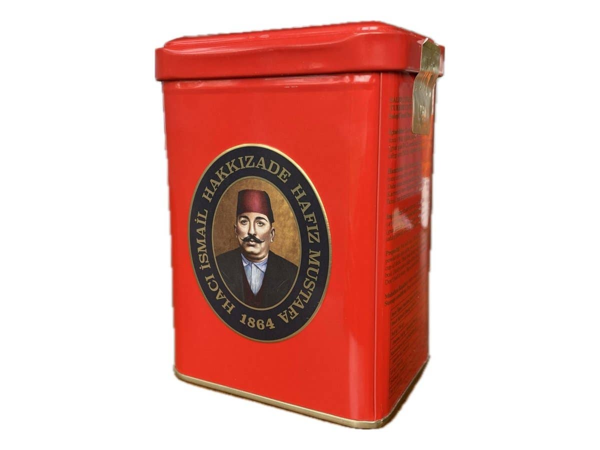 Red tin container with a logo featuring a portrait on a white background