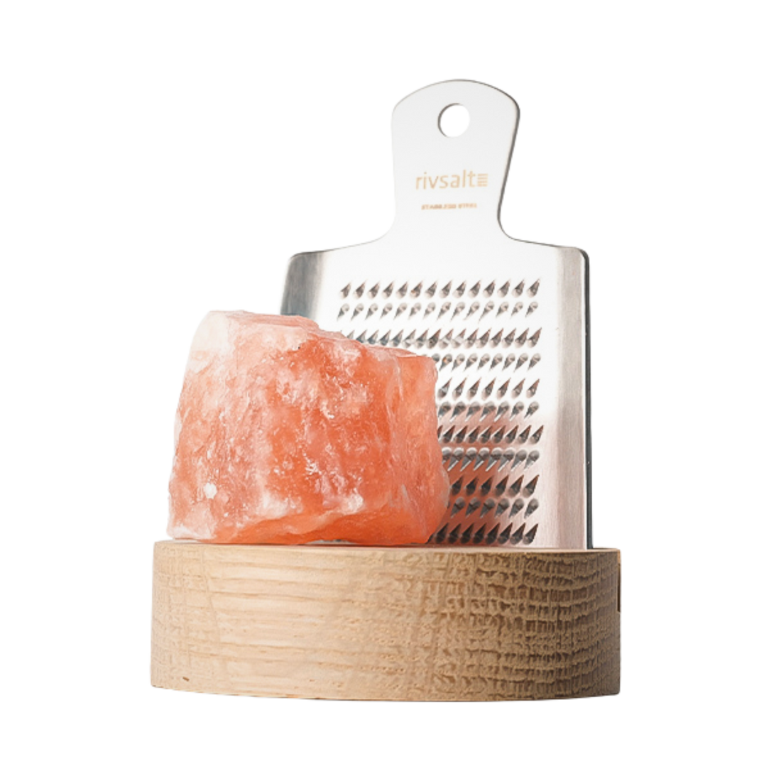 Himalayan salt block with metal grater on a wooden stand against a white background
