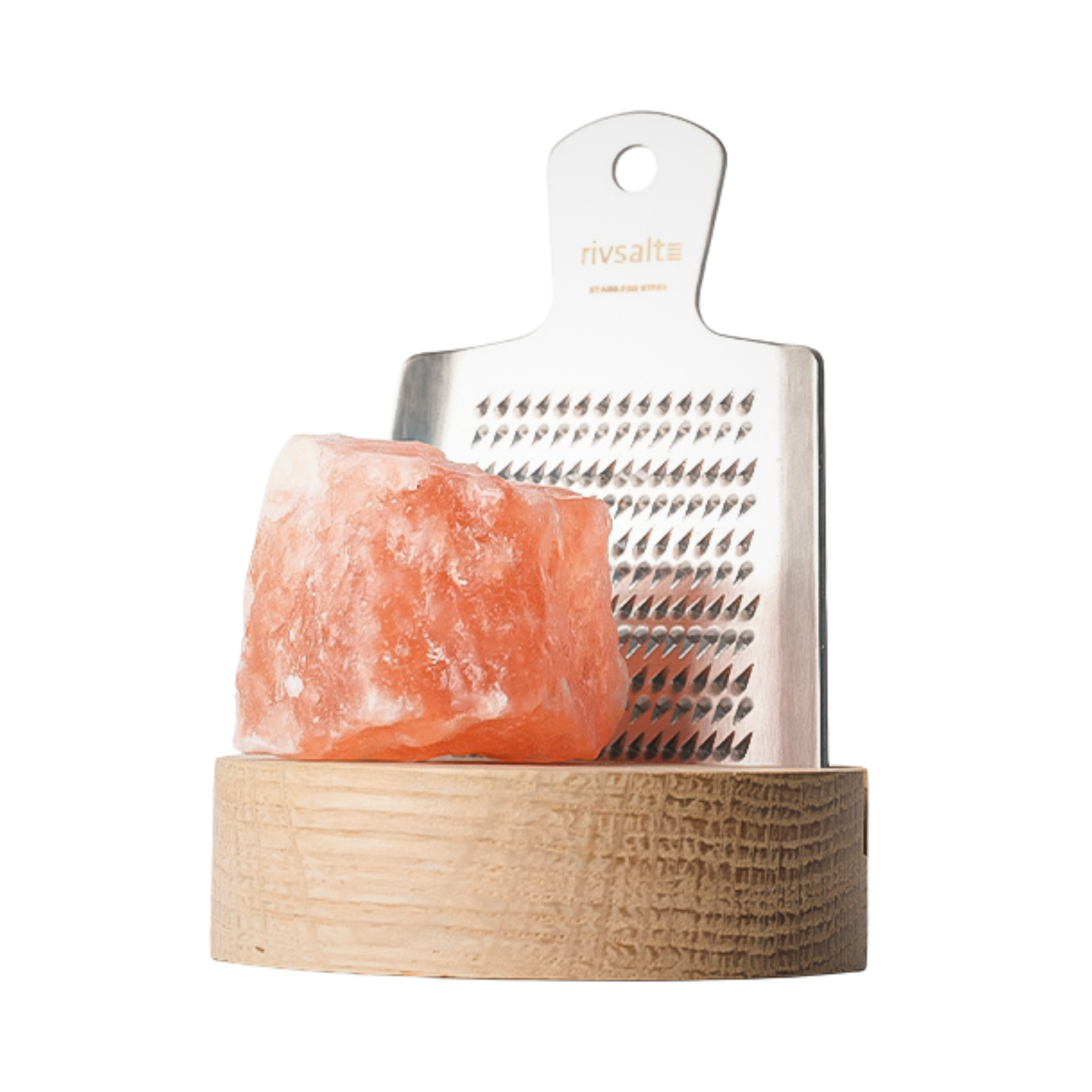 Himalayan salt block with metal grater on a wooden stand against a white background