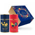 Two Monista Tea Co. canisters - Amsterdam Breakfast black tea and Very English Breakfast black tea - with a gift box on a white background